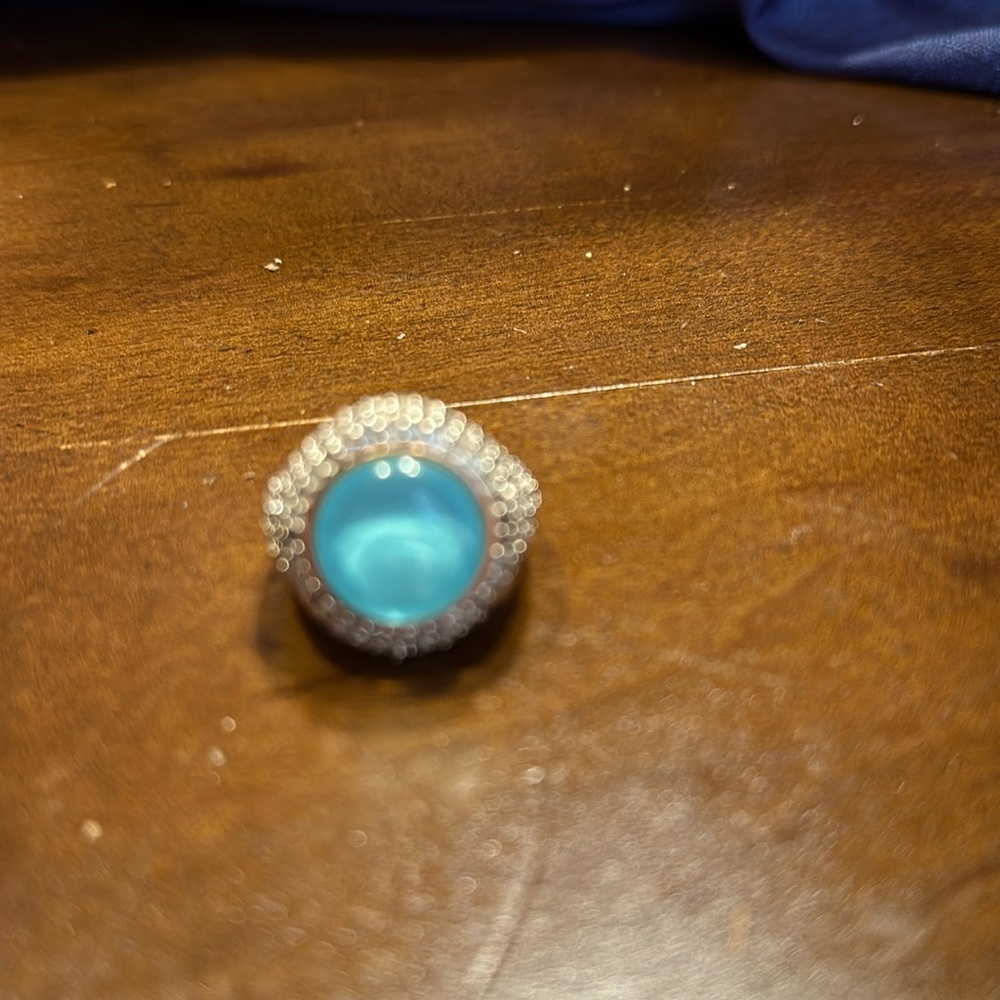 Beautiful women’s opal with crystals all around sparkling